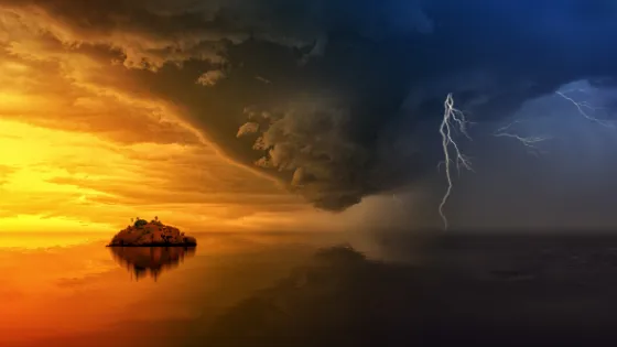 Storm clouds and lightning over a calm sea